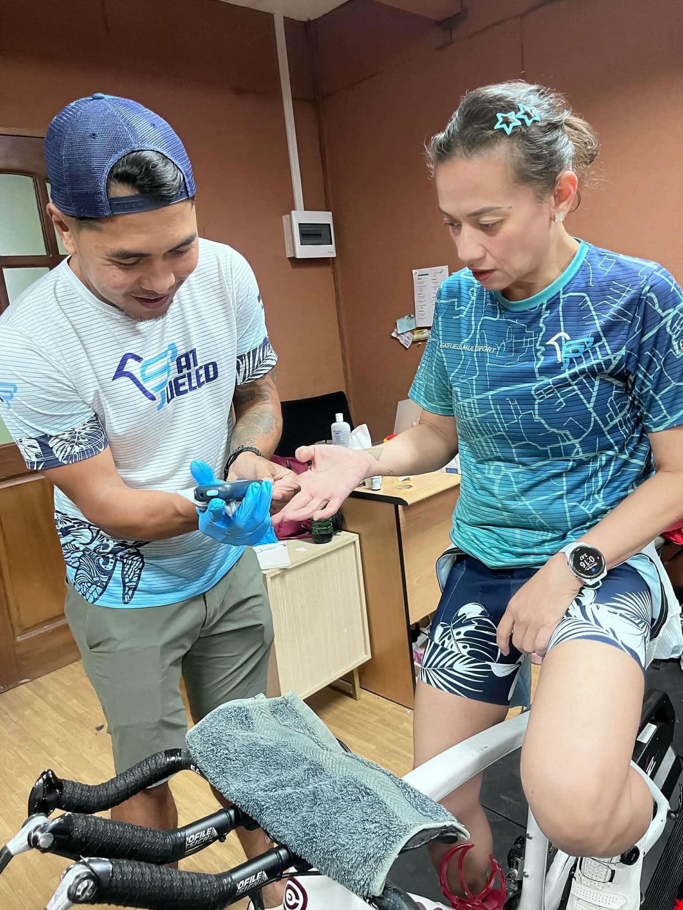 A Fat Fueled session: fingertip testing on an athlete riding an indoor trainer