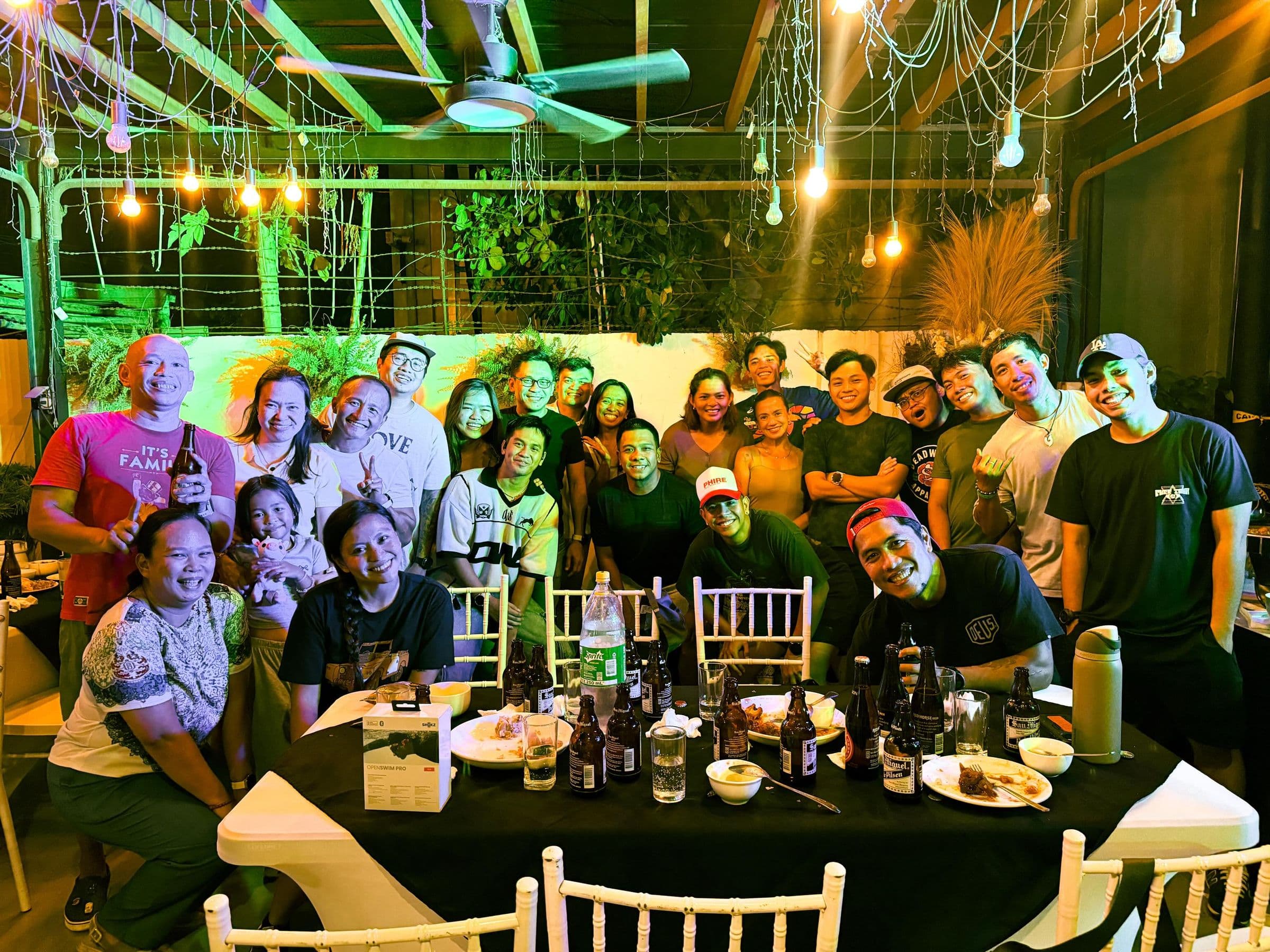 Fat Fueled athletes and friends gathered around a long table on a night out