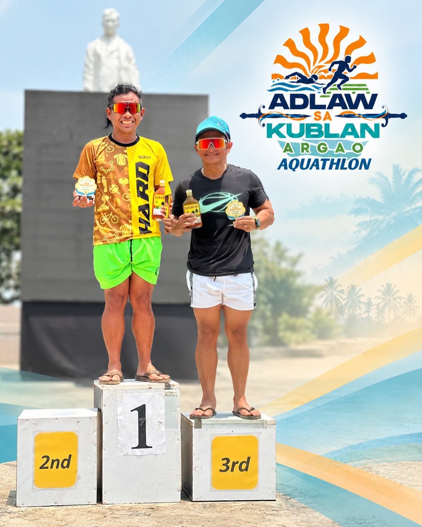 Two athletes on the podium at the Adlaw sa Kublan Aquathlon