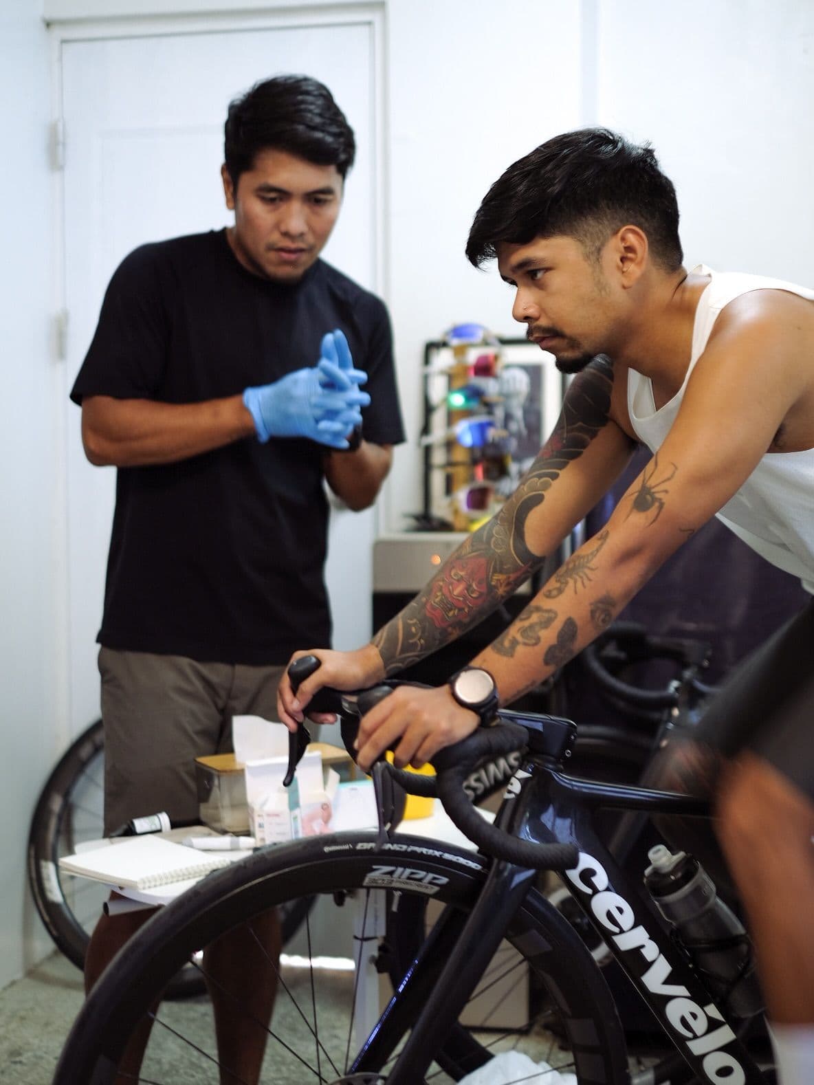 Athlete riding a road bike on an indoor trainer during a testing session